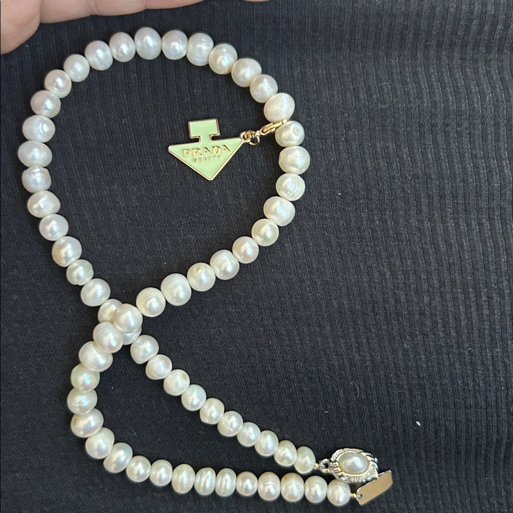Real pearl necklace with Prada Beauty charm